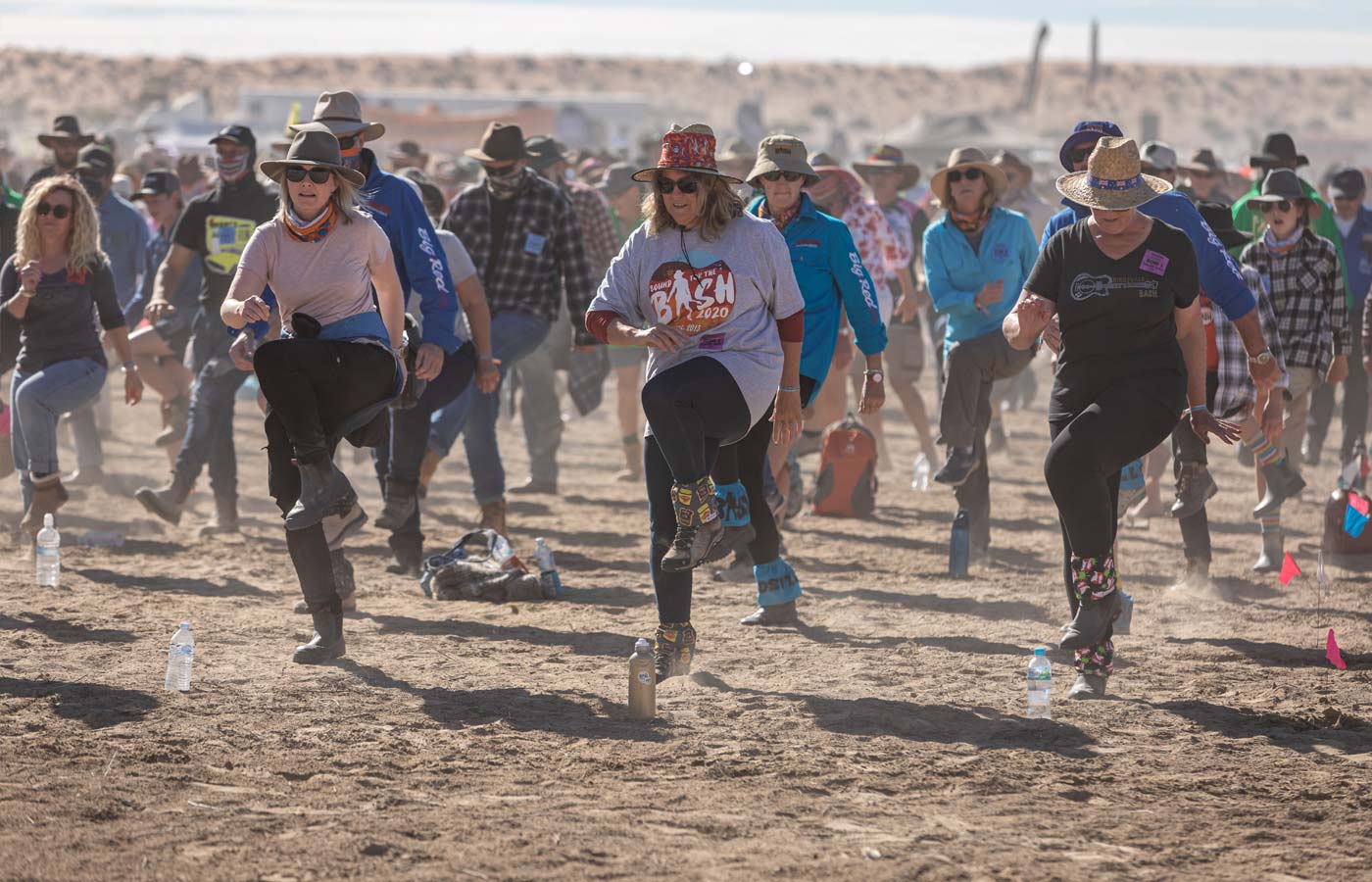 Bashers dancing the Nutbush on the red dirt